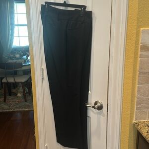 Black dress pants. Pockets front and back.